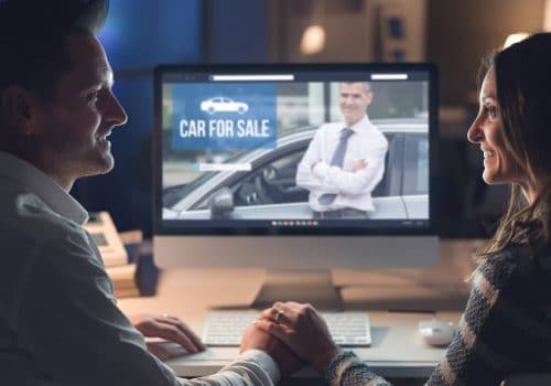 Young couple buying a car online